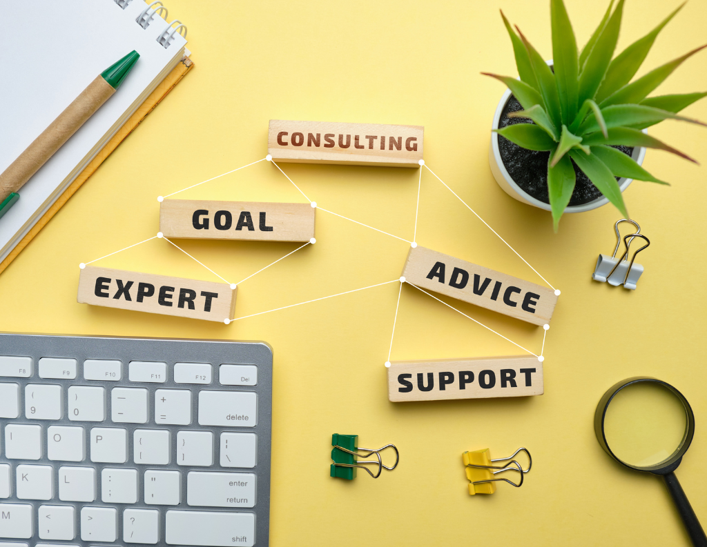 keyboard and wood words saying consulting support house