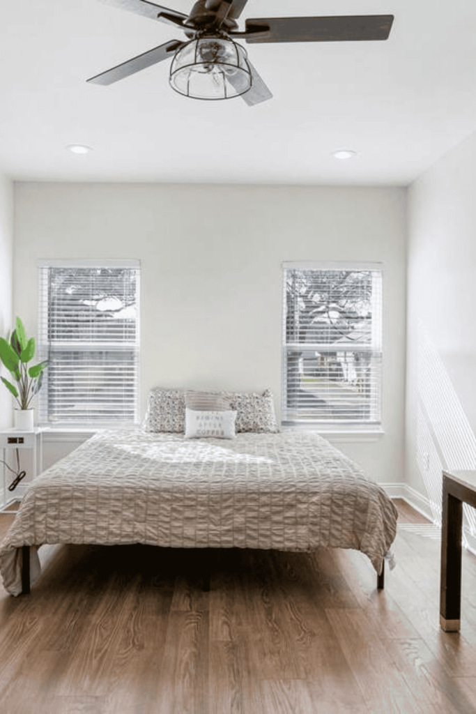 room with double bed and windows